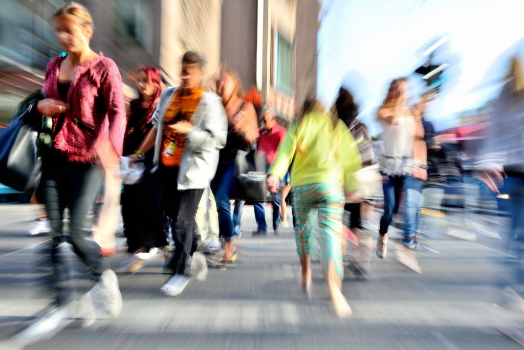 People Walking Through Road